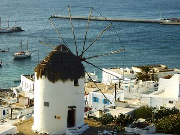 High angle view of buildings by sea