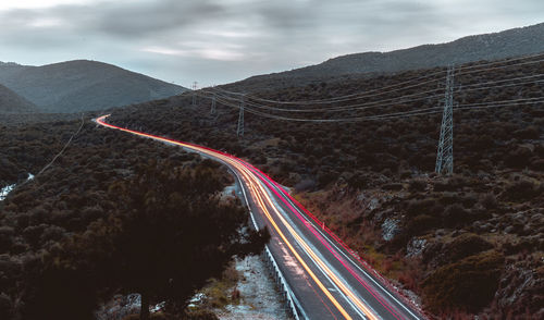 High angle view of light trails on road against sky