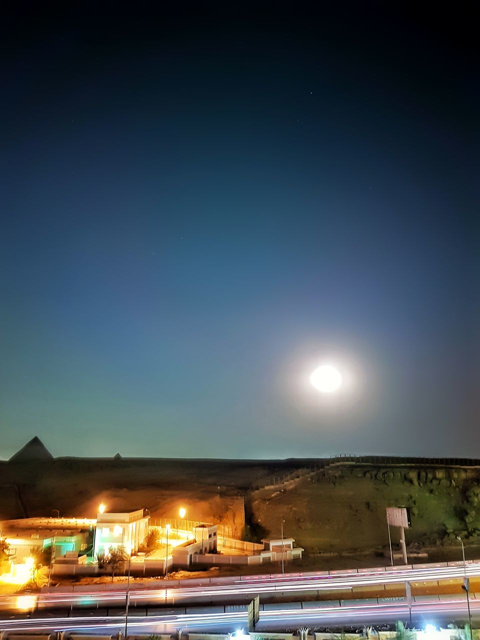 night, illuminated, moon, sky, outdoors, no people, nature, beauty in nature, clear sky, cold temperature, scenics, snow, winter, building exterior, architecture, astronomy