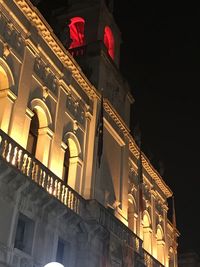 Low angle view of illuminated building at night
