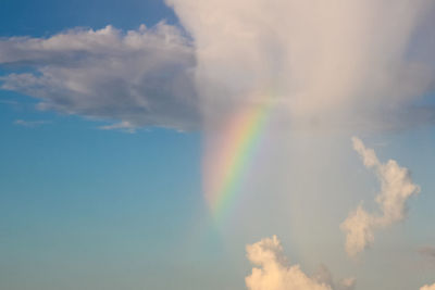 Low angle view of rainbow in sky