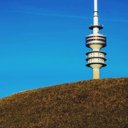 Low angle view of tower against clear blue sky