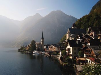 Panoramic view of buildings and mountains against sky