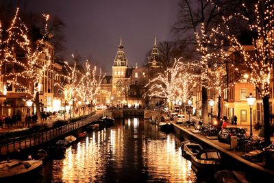 Illuminated buildings in city at night