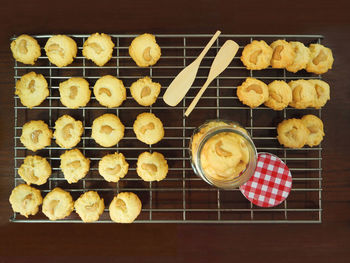 Directly above shot of homemade cookies on cooling rack at table