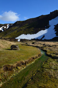 Mineral deposits in a flowing hot spring in rural iceland.