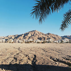 Scenic view of mountains against clear blue sky