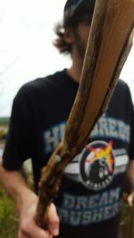 Close-up of cropped hand holding object