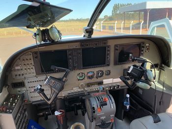 Close-up of airplane seen through glass window