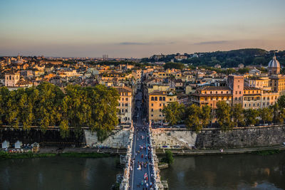 River amidst buildings against sky in rome