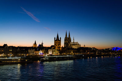 View of illuminated city at waterfront