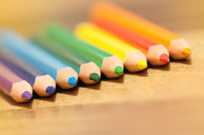 Close-up of colored pencils on table
