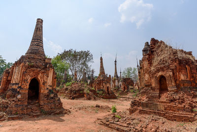 Old temple building against sky