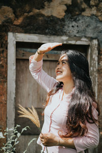 Portrait of young woman looking at camera