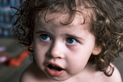 Close of little brazilian girl looking up