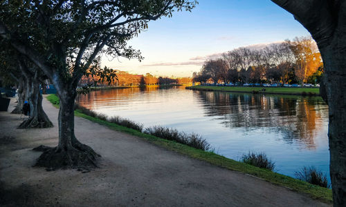Scenic view of lake against sky at sunset