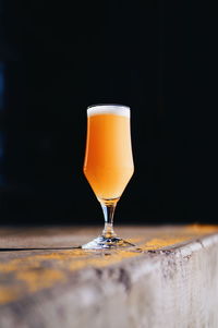 Close-up of beer glass on table