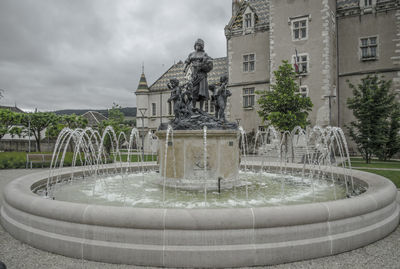 Fountain in front of building