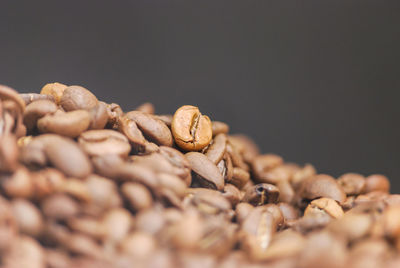 Close-up of roasted coffee beans on table