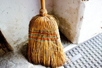 High angle view of broom against wall