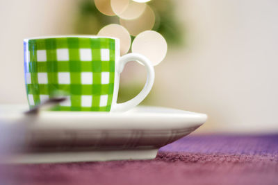 Close-up of coffee cup on table