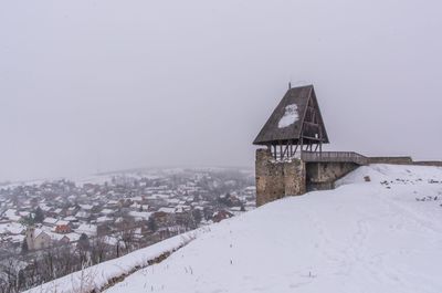 Traditional house against clear sky during winter