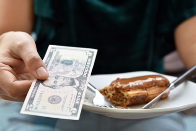 Close-up of hand holding food