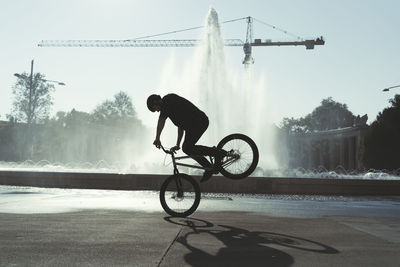 Man riding bicycle on street