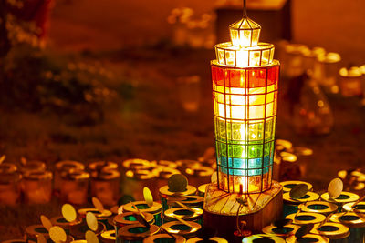 Close-up of illuminated lantern on table