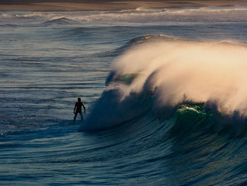 People surfing in sea