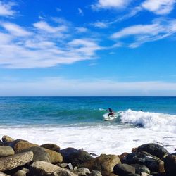 Scenic view of sea against blue sky