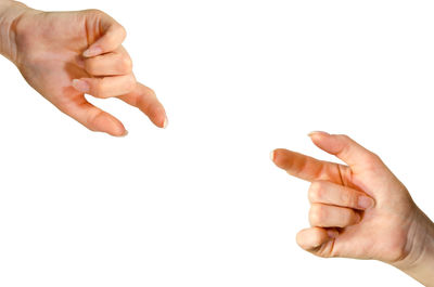 Close-up of hands over white background