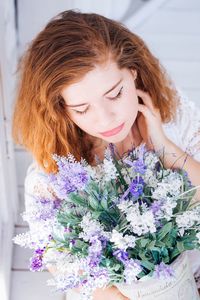 Close-up of woman holding flowers