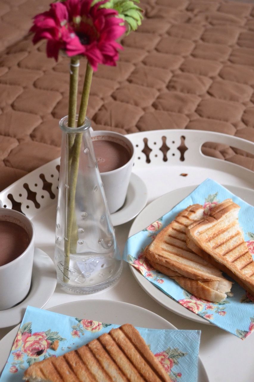 food and drink, table, freshness, drink, indoors, refreshment, still life, high angle view, coffee cup, coffee - drink, food, spoon, drinking glass, ready-to-eat, fork, sweet food, tablecloth, breakfast, indulgence, saucer