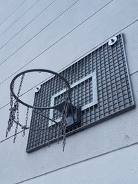 Low angle view of basketball hoop against building