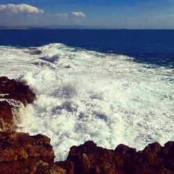 Waves splashing on rocks