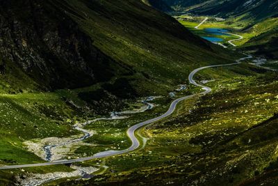 High angle view of road amidst mountains