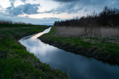 Little uherka river and evening clouds