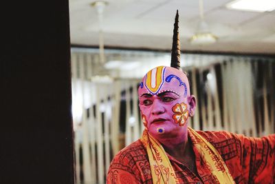 Portrait of young man in traditional clothing