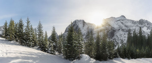 Scenic view of snow covered mountains against sky