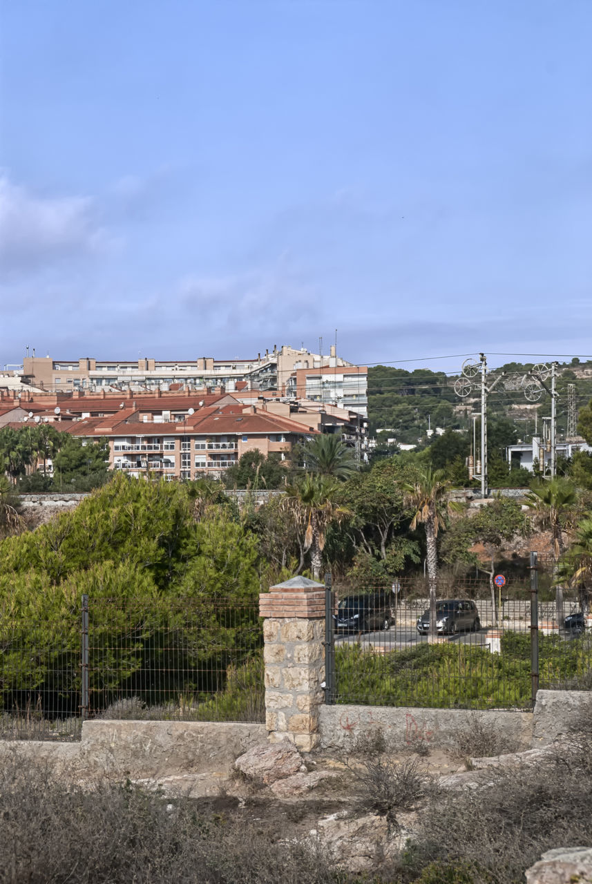 BUILDINGS AGAINST SKY