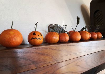 High angle view of pumpkins on table against wall