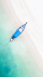 Aerial view of boat moored at beach