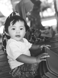 Portrait of cute baby boy sitting at home