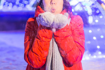 Full length of woman standing in snow