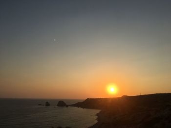 Scenic view of sea against clear sky during sunset