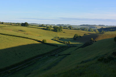 View towards poyntington along valley through green fields, oborne, sherbonre dorset, england.