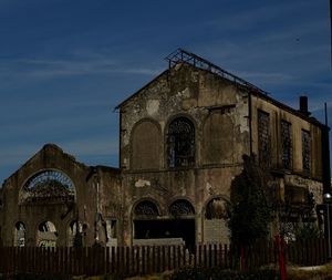 Low angle view of old building against sky