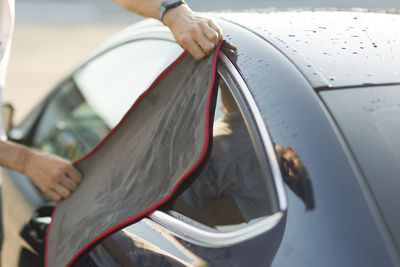 Low section of man driving car