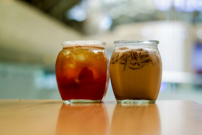 Close-up of drink in glass jar on table
